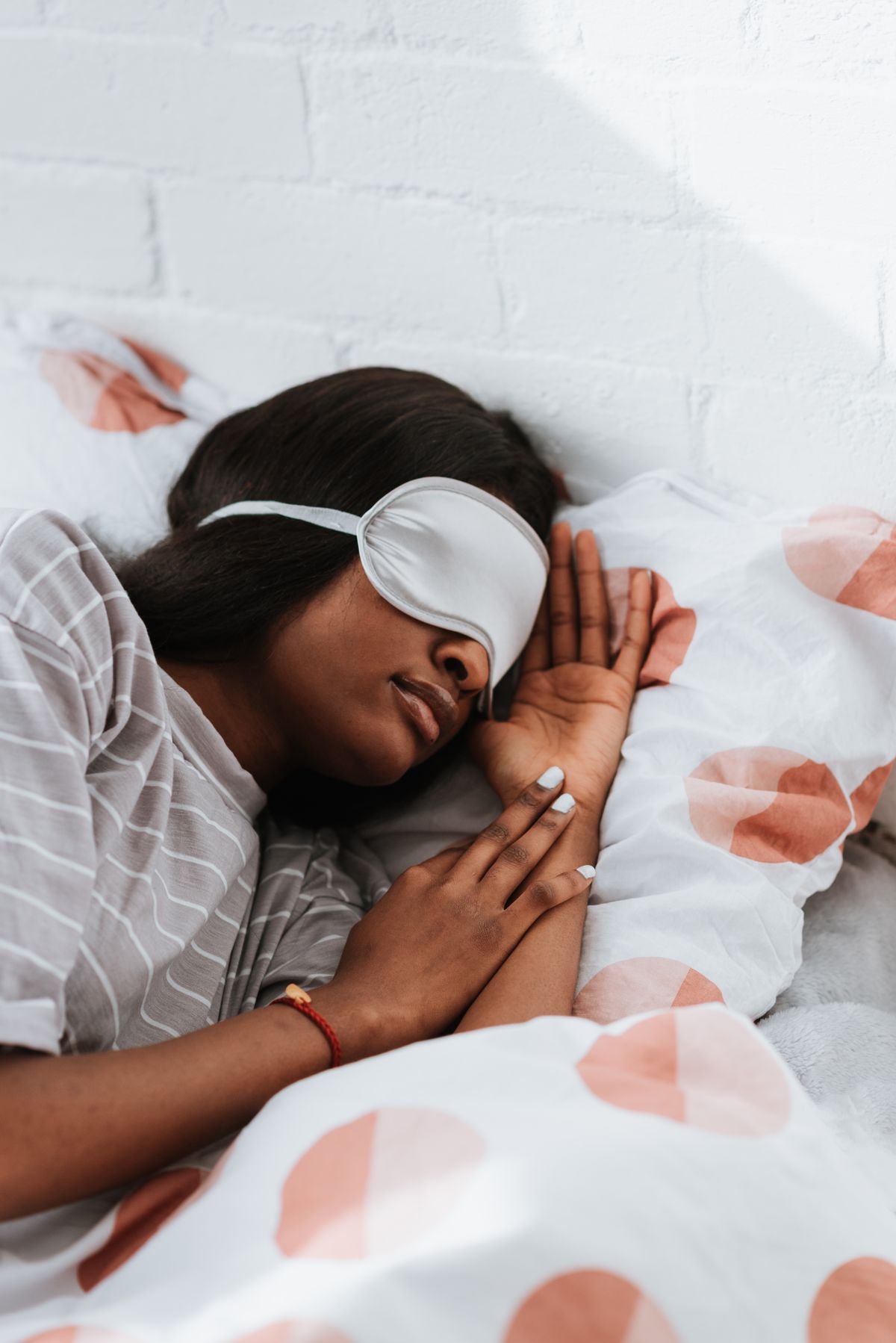 A woman asleep in a calm bedroom