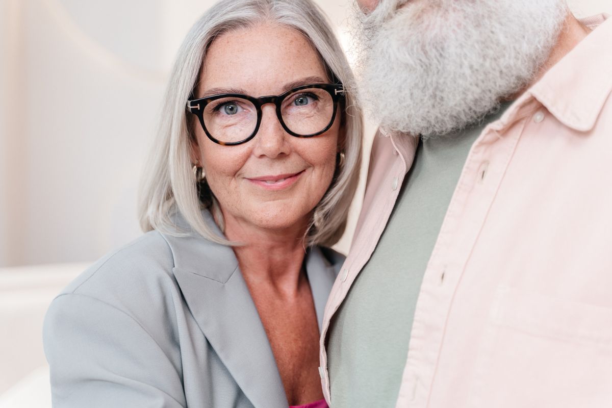A smiling woman in midlife