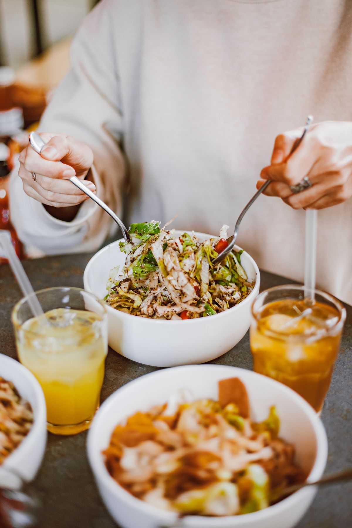 Person eating a healthy salad bowl
