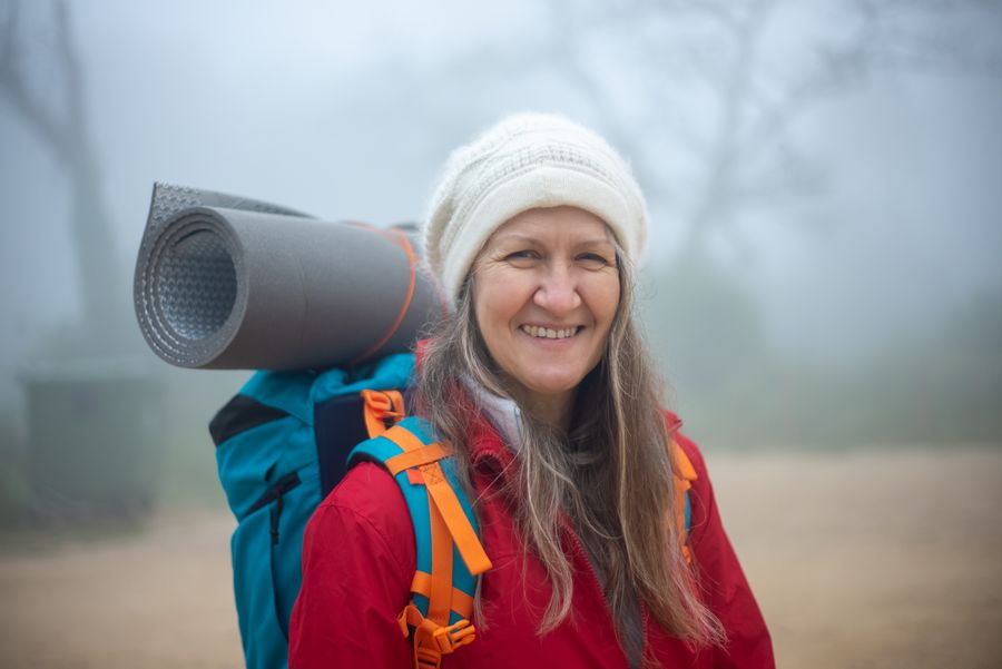 Active woman hiking outdoors in nature