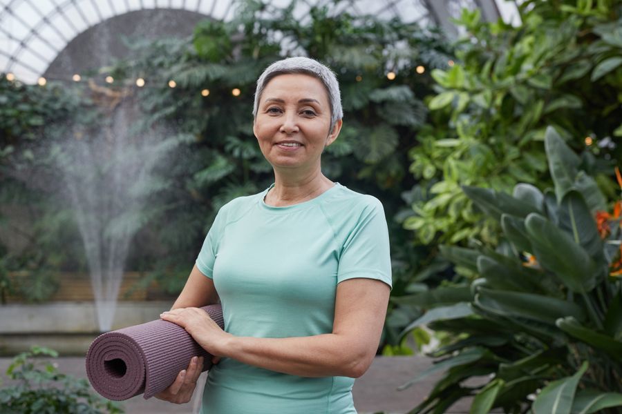 Woman doing gentle yoga in a garden