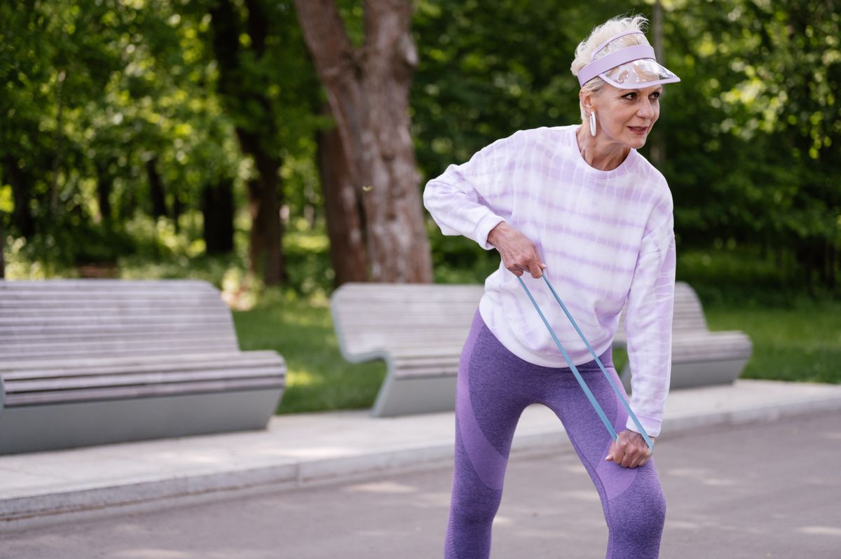 A woman strength training with weights