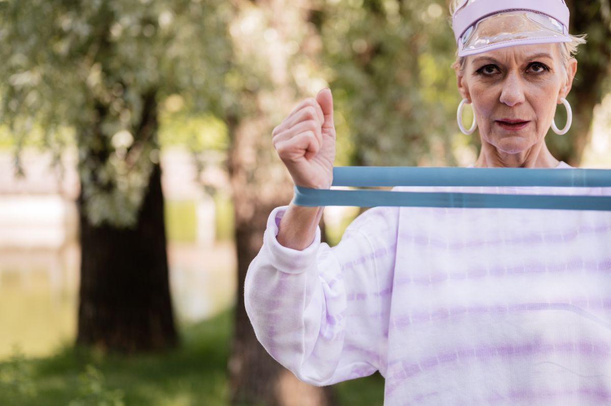 A mature woman walking outdoors